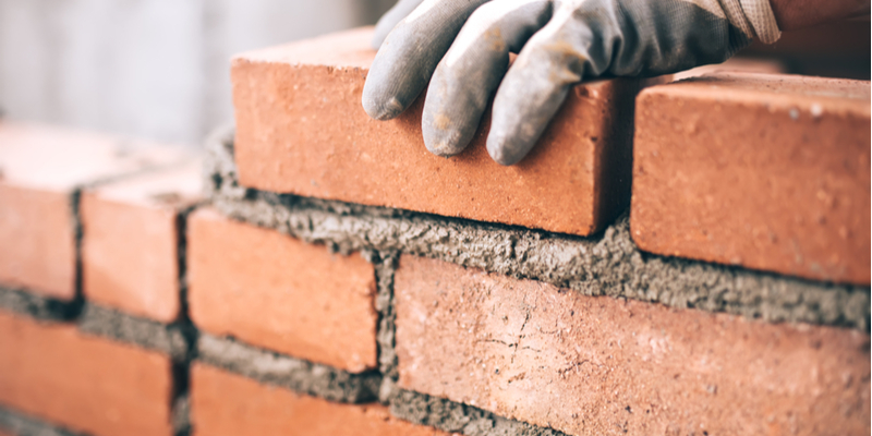 repair leaning brick wall